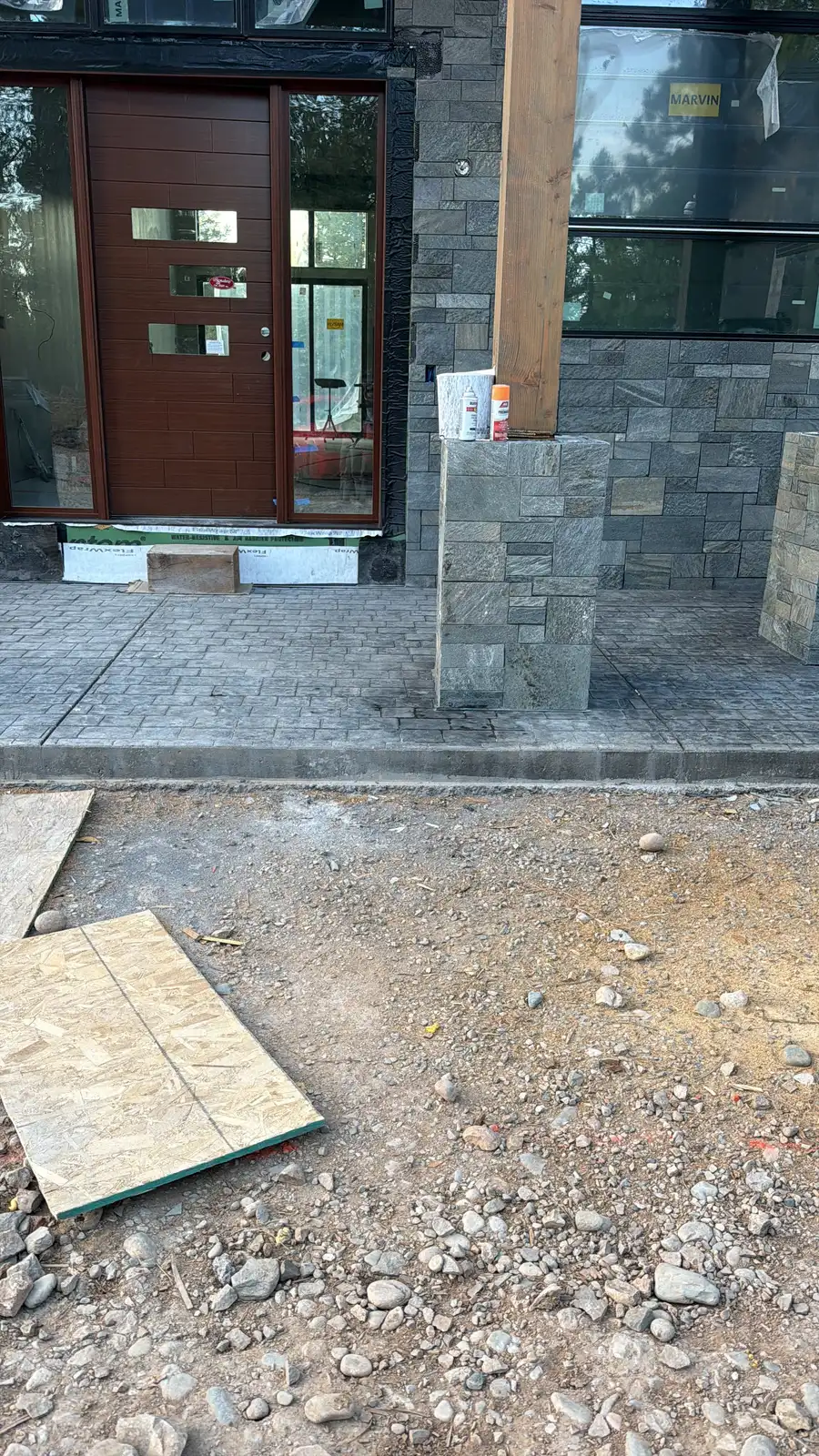 Stone entry columns and patio by JH Construction, San Juan County, NM
