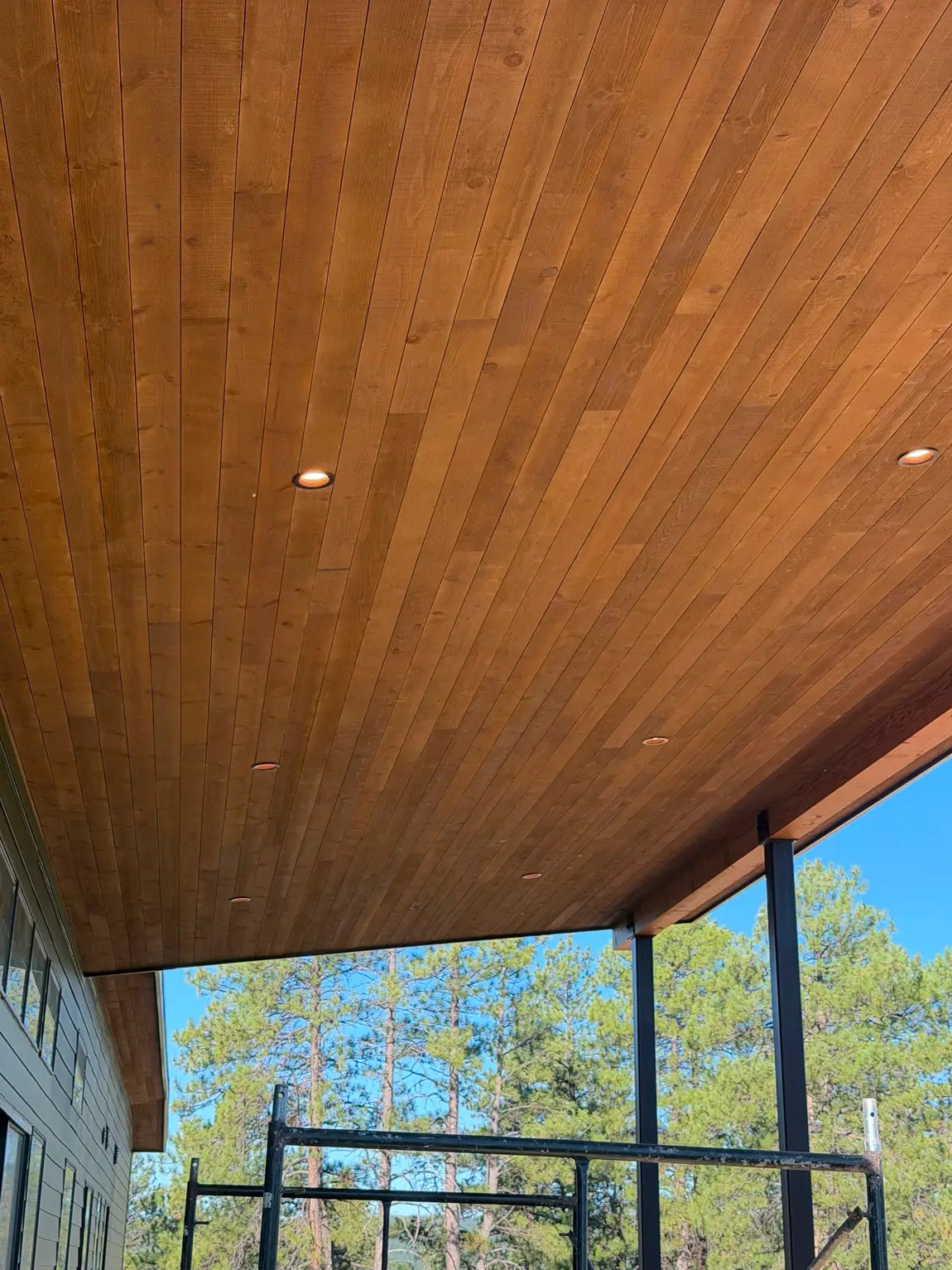 Covered patio with wood ceiling built by JH Construction, San Juan County, NM